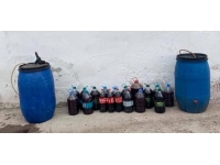 Tekirdağ'da bir evde 260 litre kaçak içki ve ruhsatsız silah ele geçirildi